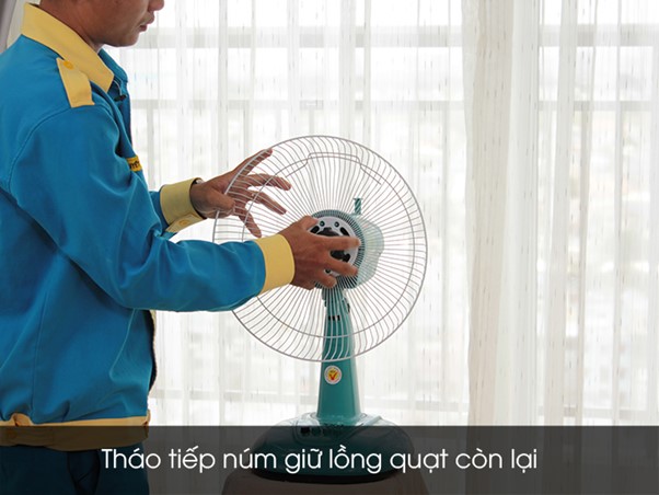 Remove the rear fan cage holder and remove the rear fan cage from the fan